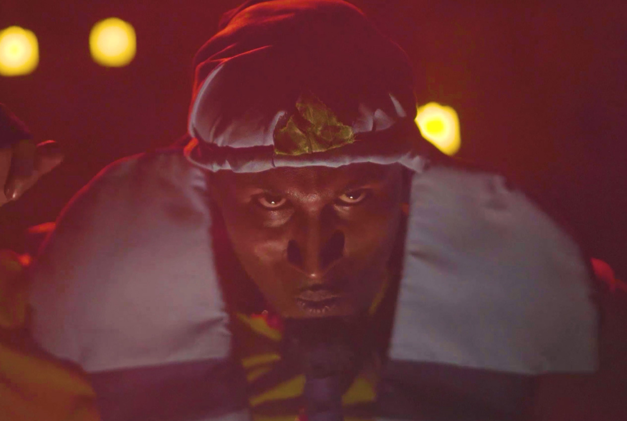 Graded raw frame of a performer before visual effects are added