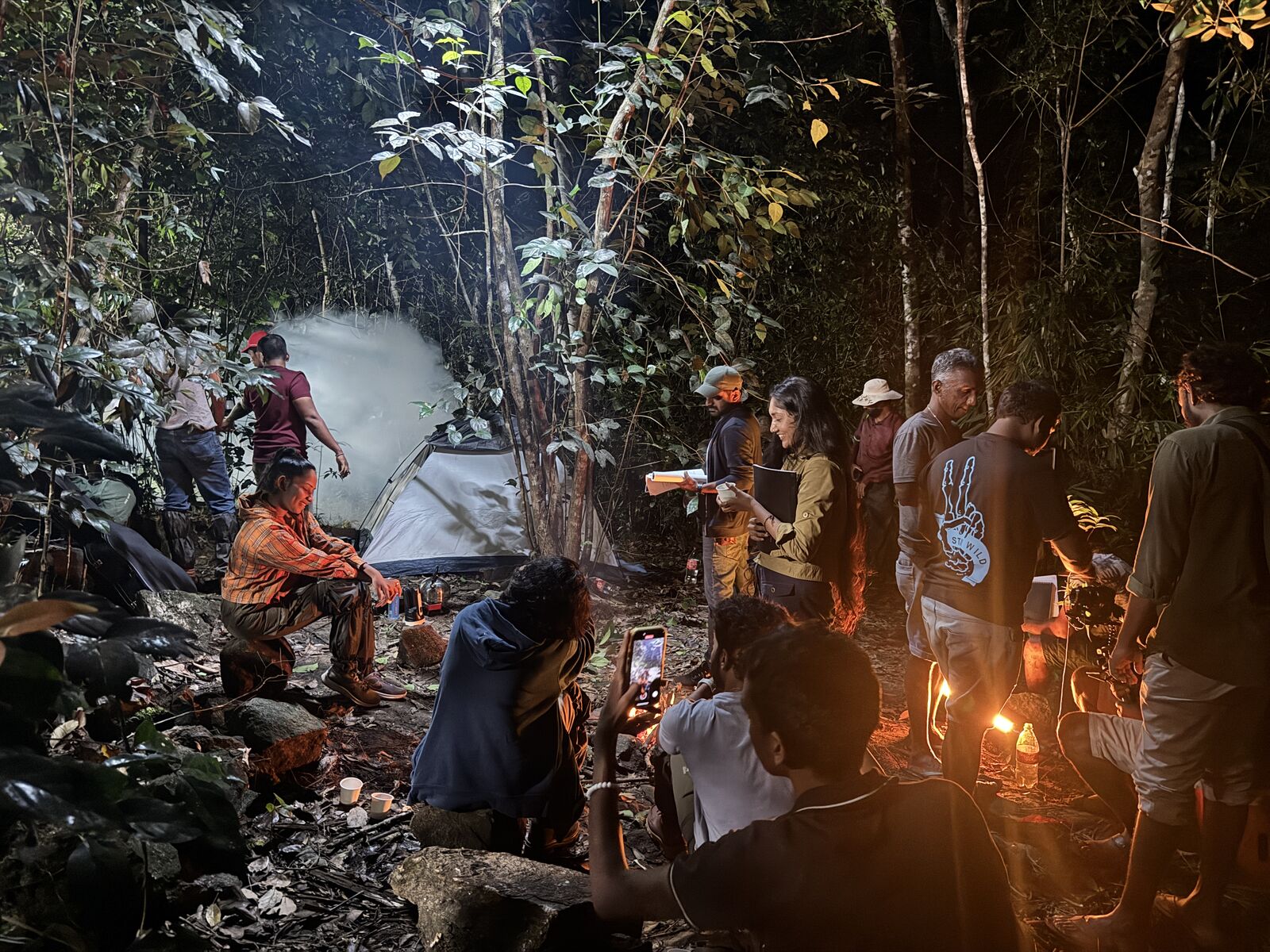 Crew member operating camera equipment on a teledrama set