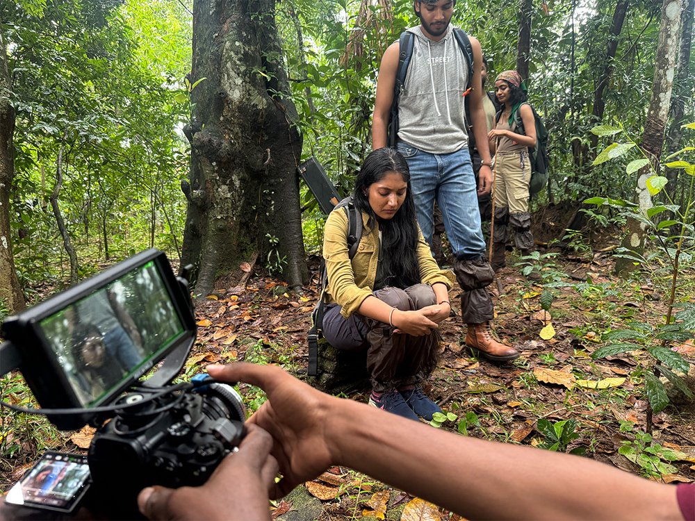 Boom operator working a forest scene
